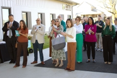 Group listening to remarks at ribbon cutting event